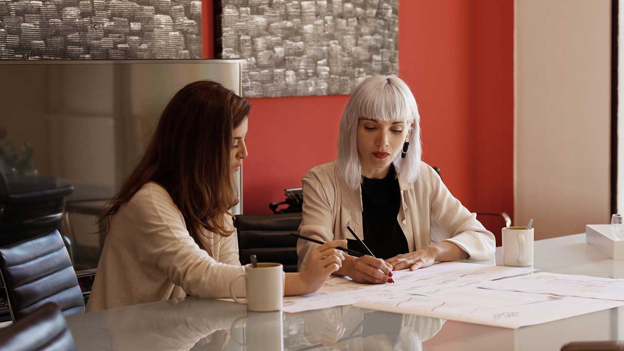 two women working on a project