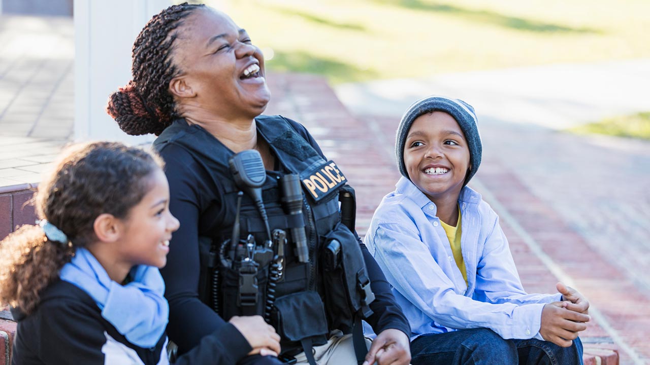 policewoman laughing with kids