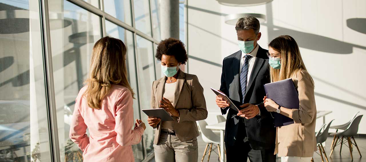 business people wearing masks