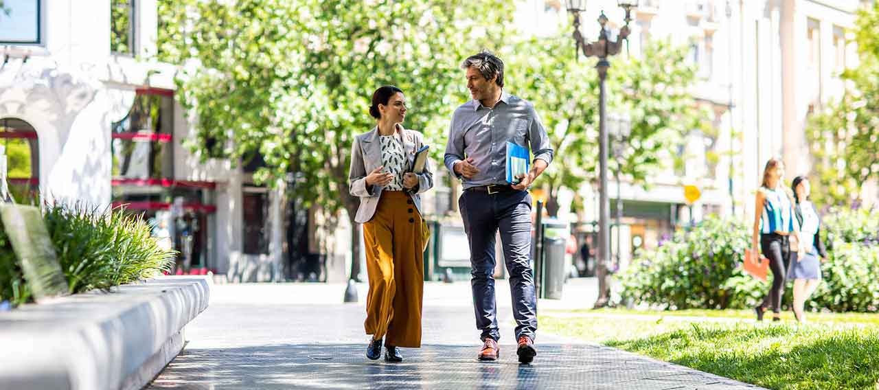 two business people walking together