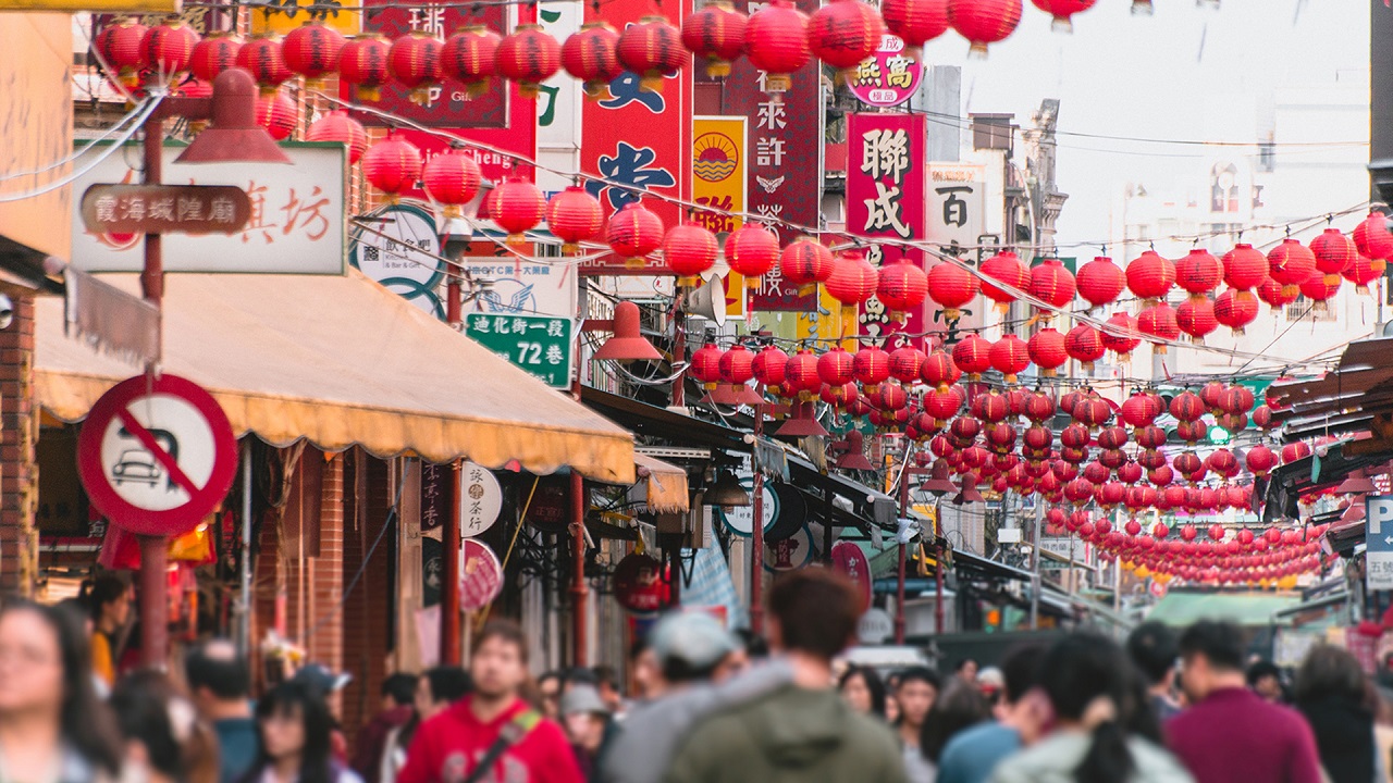 pedestrian traffic along bright colorful market stands